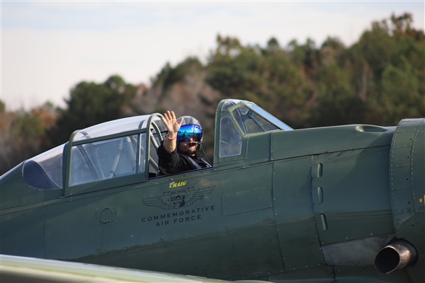 Pilot in Airplane Waving