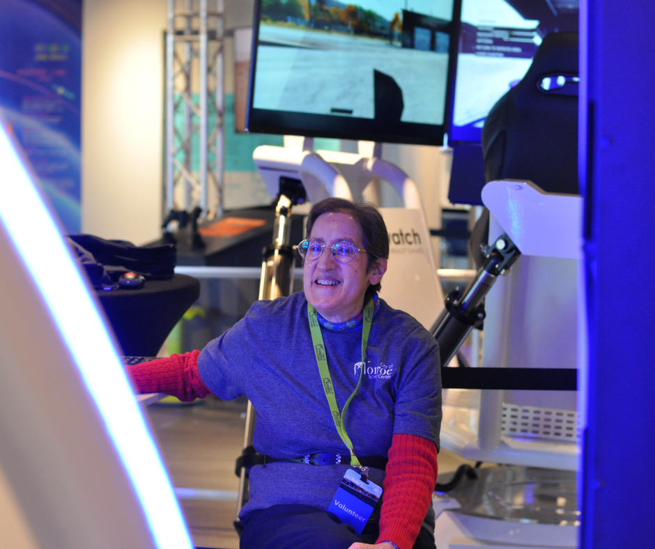 Adult Volunteer operating VR chairs